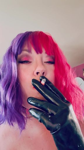Key moment from &quot;Chubby Cougar Tina Snua Smokes A Cork Tipped Cigarette In Latex Gloves -&quot;