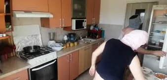 Amateur couple cooks naked in the kitchen