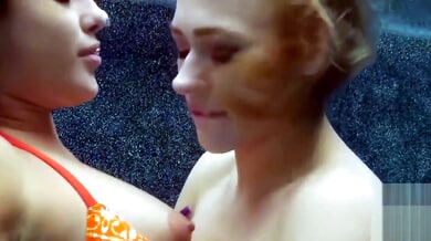 Brunette and blonde lovers share steamy underwater kisses before moving to the carpet