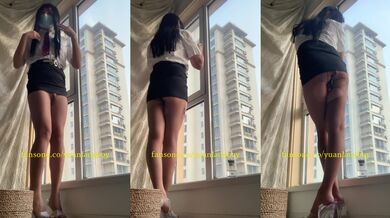 Chinese ladyboy wears black stockings and squirts in front of the floor-to-ceiling window