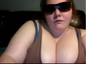 Fat and skanky white bitch in sunglasses on the webcam