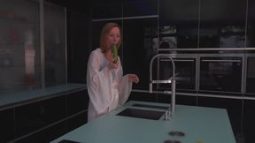 Very hot amateur uses a cucumber to masturbate in kitchen