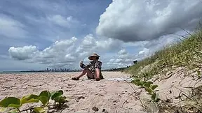 Curvy OLDER WOMAN exposes hairy snatch at public beach