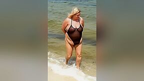 Handcuffed In Sheer Swimsuit On The Beach