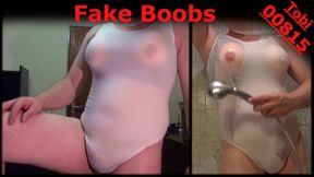 Fake Boobs - posing in white sports-body, shaved.