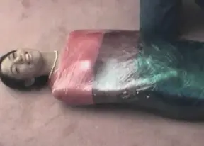 Samantha Love wrapped in plastic