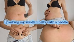Swollen belly y spanking to the point of redness