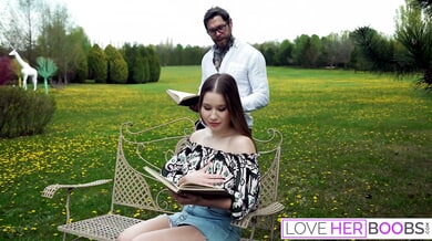 Dean Van Damme enjoys a passionate titjob from a brunette with huge tits in a sunlit modern lounge