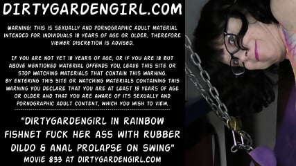 Dirtygardengirl in rainbow fishnet fuck her ass with rubber dildo & anal prolapse on swing