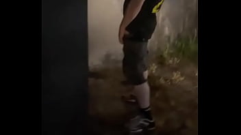 Helping him pee in the street