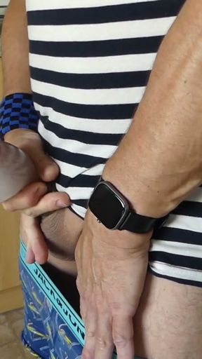 Jerking off in the kitchen and squirting into a condom filled with water, "underwater," so to speak.   Clip 2