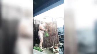 Blonde daddy showers and strokes by the pool