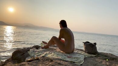 Russian stranger rubs sunscreen on my red head at the nudist beach
