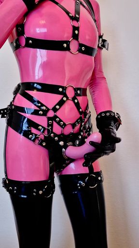 Latex-clad fetish babe shows off her tight outfit and sultry moves.
