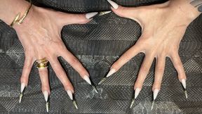 The new nail shape is even longer, sharp stilettos, long fingers, cream hands, jewelry