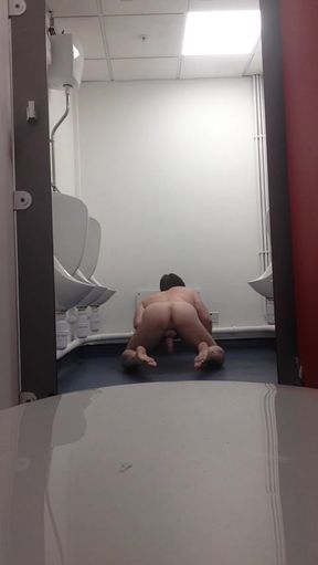 Risky wank in a public toilet