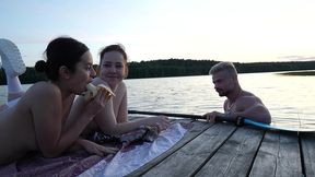 two girls took their clothes off on the lake. a passing surfer had sex in the open air.