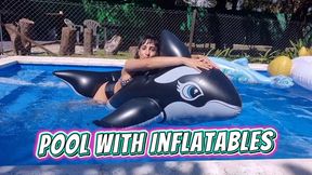 Alesia having fun in the pool with inflatables