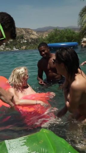 A massive blowbang swimming pool party