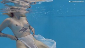 Finnish beauty swims nude in the pool