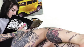 Tattoed girl puts her feet in your face