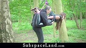 Damsel in latex and facemasked fully in outdoor bdsm