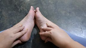 Alice scratching the pronounced arches of her feet (2)