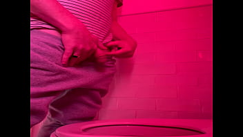 Amateur guy pissing in the toilets of a bar