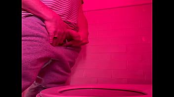 Amateur guy pissing in the toilets of a bar