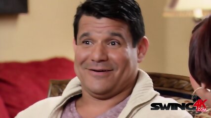 Kissing contest between swapped swinger couples at a BBQ party.