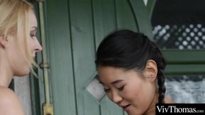 Sexy lesbian and asian lover finger each other out in the garden