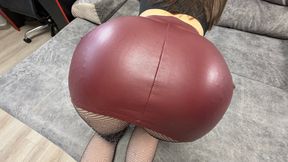 A huge ass in a red leather skirt was stretched over a guy's dick!