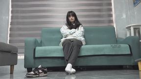 Yu Yu removes her sneakers and white socks to show her tender soles
