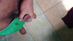 a young man masturbating in a quiet kitchen
