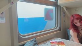 Red-haired girl naked on the train