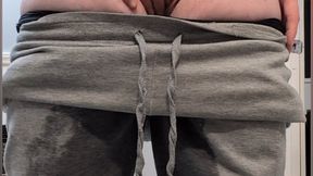 Holding and Leaking in Grey Sweatpants, then Exploding and Stripping to Show Off
