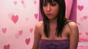 Beautiful black haired webcam girl plays with her big tits