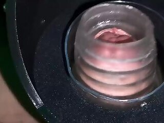 A jerk-off robot tests the stamina of a large penis.