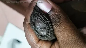 Hairy mature Indian guy strokes his big black cock in bathroom solo