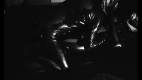 Bound in latex, he takes control