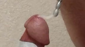 Crossdresser beats off with estim and urethral sounding