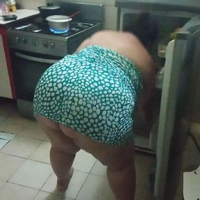 chubby stepmother in the kitchen preparing a delicious dinner