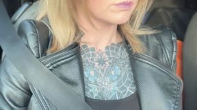 Smoking in the car with sunglasses and leather jacket!