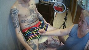 I'm sitting on a stool, a fat woman jerks off my cock