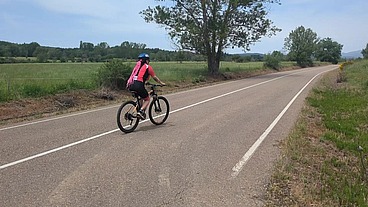 Two hot cyclists meet on the road