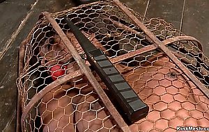 Ebony slave gets vibrated in cage