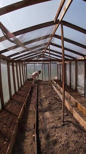 Nude house wife working in the greenhouse