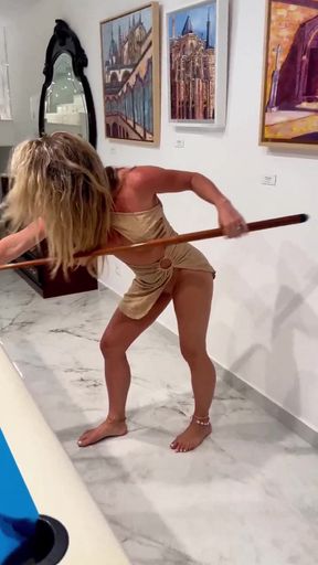 Blonde woman in bikini playing pool