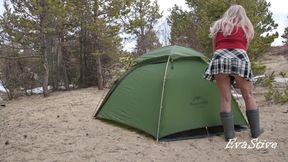 A gorgeous blonde without panties is assembling a tent. For lovers of peeping