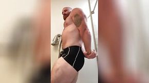 Bodybuilder in Tight Posing Trunks